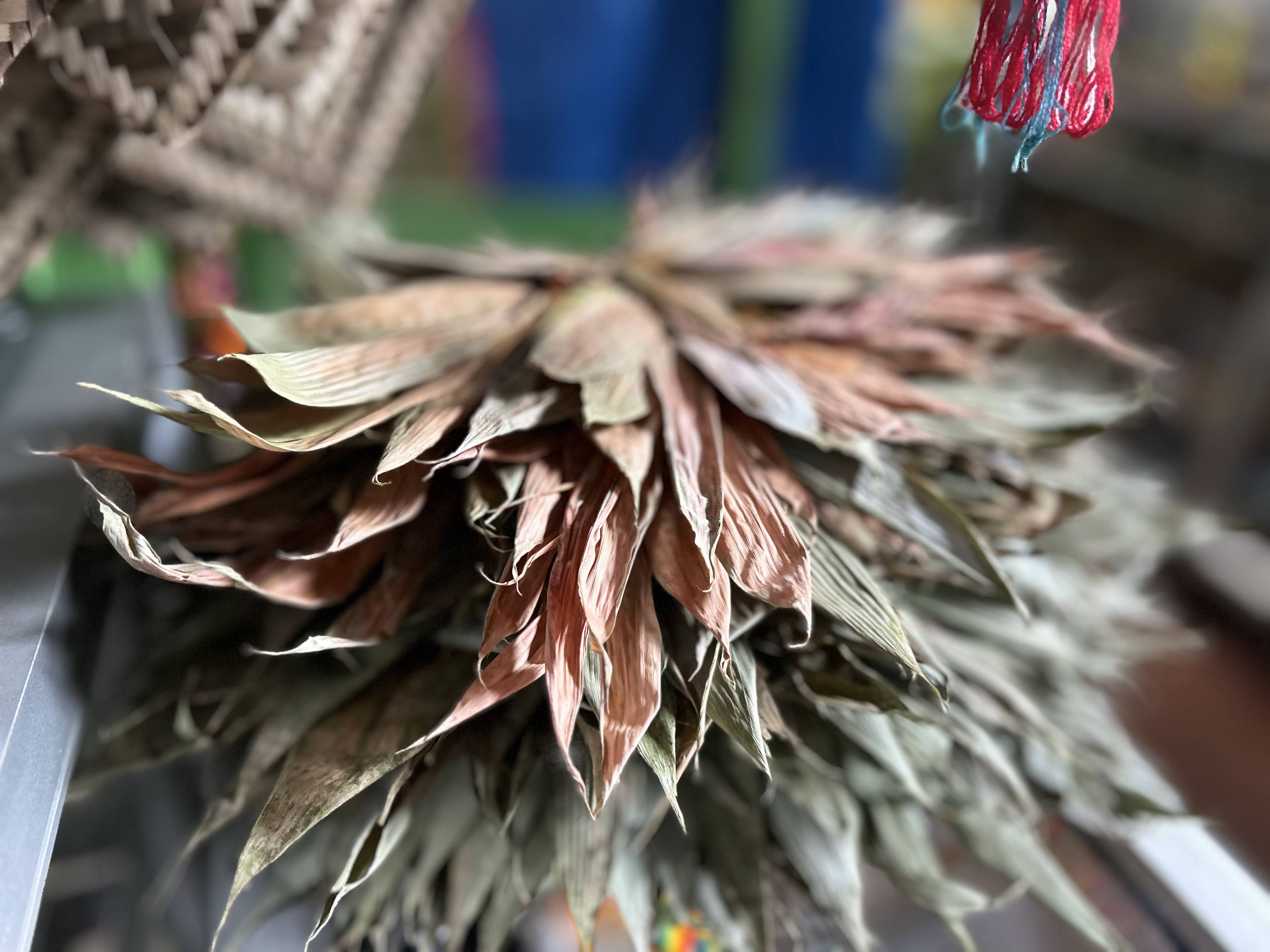 A ceremonial feather headdress in warm earth tones