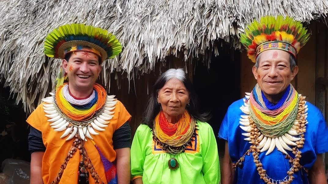 Taitas of the Cofán lineage with the abuela elder outside the maloca